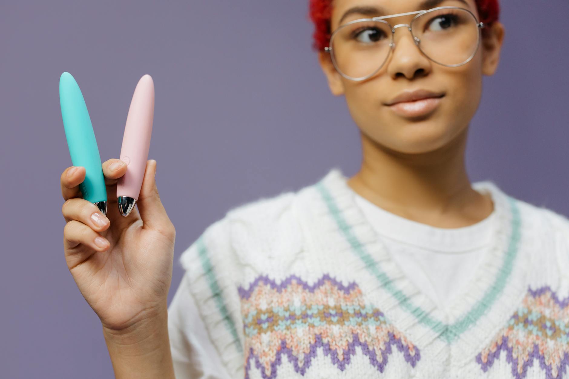 A woman holds colorful lemon vibrators, exploring sensation after medication adjustment